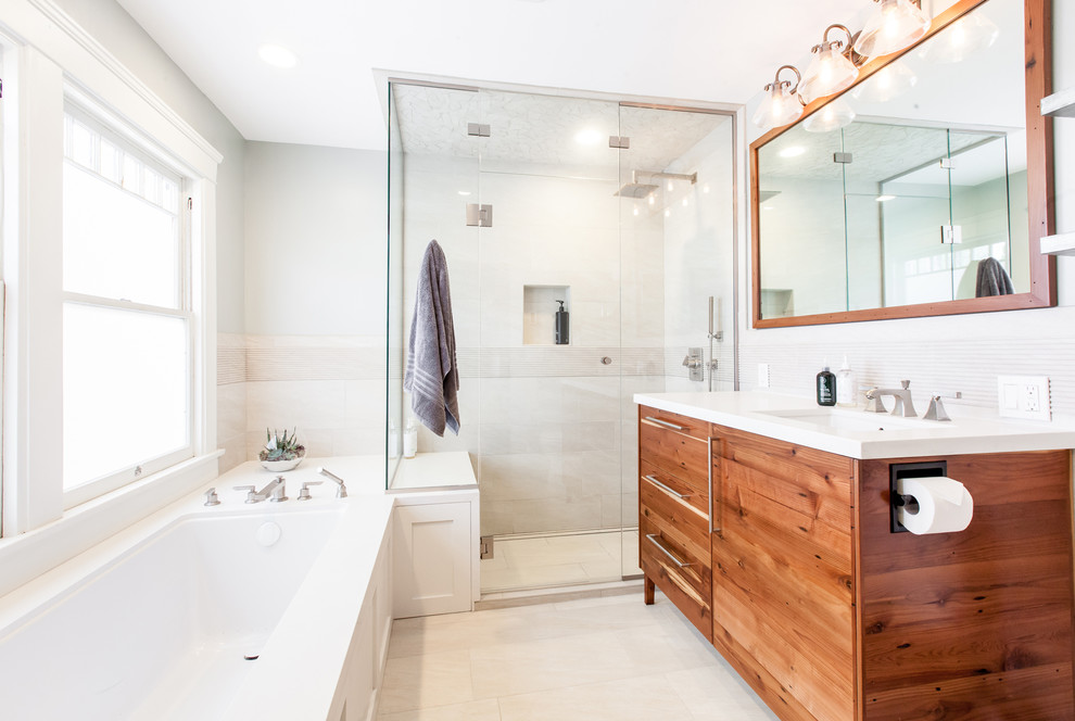 Mid-sized transitional master bathroom in San Diego with flat-panel cabinets, brown cabinets, an undermount tub, a corner shower, grey walls, an undermount sink, engineered quartz benchtops, a hinged shower door, white benchtops, a single vanity and a freestanding vanity.