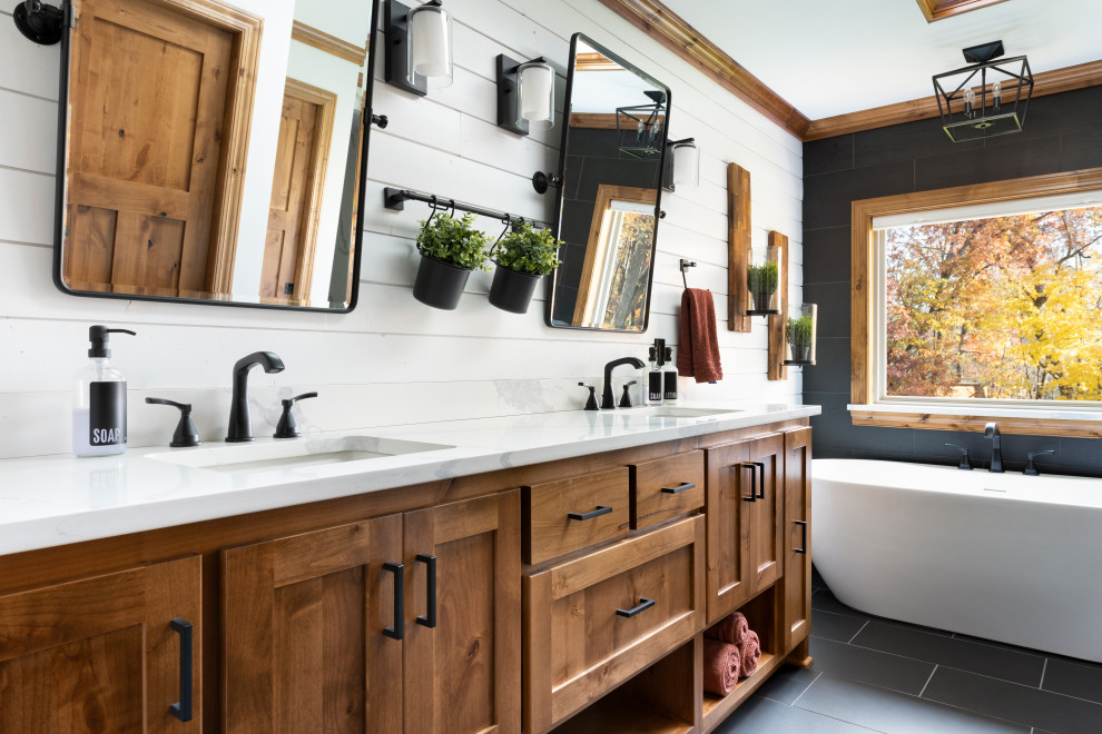 Design ideas for a country master bathroom in Minneapolis with shaker cabinets, medium wood cabinets, white walls, engineered quartz benchtops, black floor, white benchtops, a double vanity, a built-in vanity and planked wall panelling.
