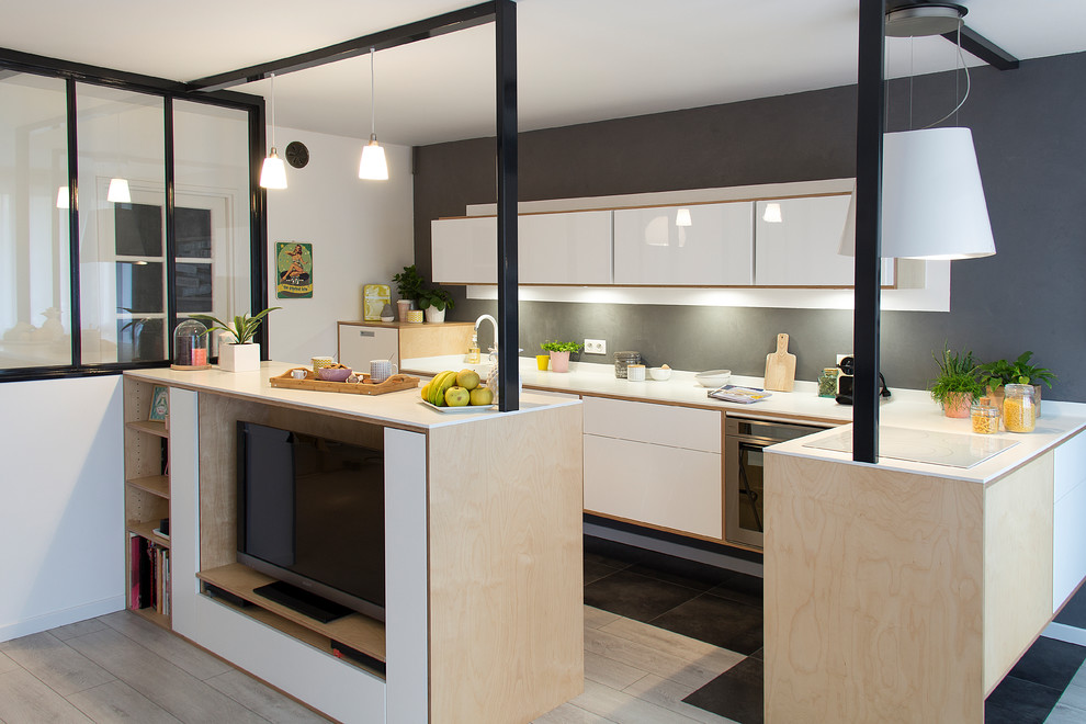 Inspiration for a mid-sized scandinavian l-shaped open plan kitchen in Other with an integrated sink, beaded inset cabinets, light wood cabinets, solid surface benchtops, white splashback, white appliances, ceramic floors, with island and grey floor.