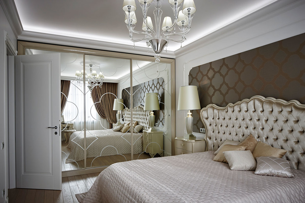 Photo of a transitional master bedroom in Moscow with white walls, light hardwood floors and beige floor.
