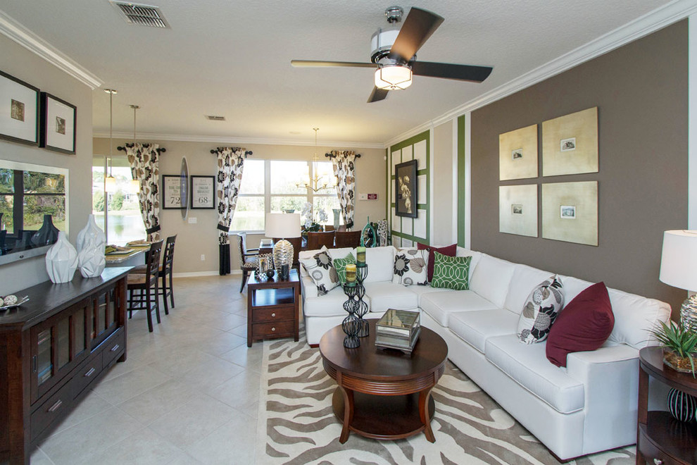 Photo of a mid-sized transitional open concept living room in Orlando with beige walls, ceramic floors and a wall-mounted tv.