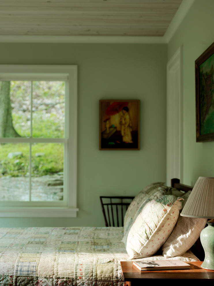 Large farmhouse master medium tone wood floor bedroom photo in Burlington with green walls and no fireplace