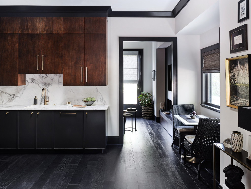Photo of a mid-sized eclectic u-shaped open plan kitchen in San Francisco with an undermount sink, flat-panel cabinets, dark wood cabinets, solid surface benchtops, stone slab splashback, black appliances, dark hardwood floors, no island, black floor, white benchtop and white splashback.