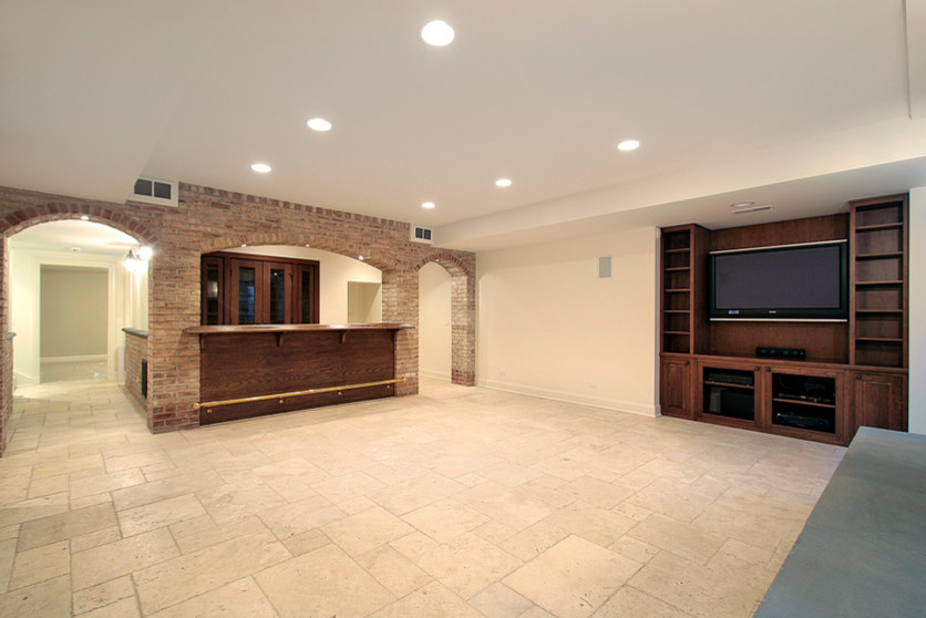 Transitional underground basement photo in Chicago with beige walls and no fireplace