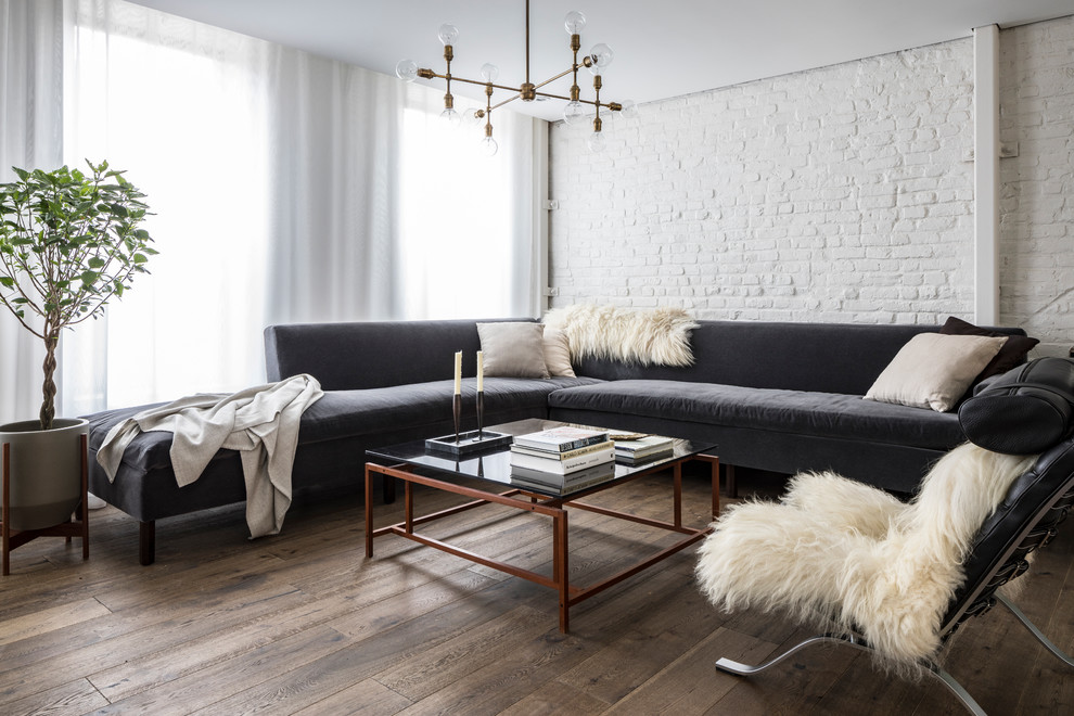 Inspiration for a mid-sized scandinavian open concept dark wood floor and brown floor living room library remodel in New York with white walls