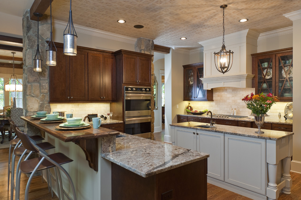 Design ideas for a traditional kitchen in Other with stainless steel appliances and granite benchtops.