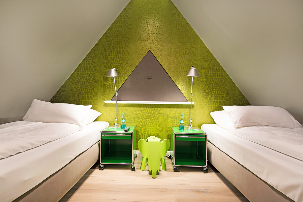 Small contemporary gender-neutral kids' room in Other with green walls and light hardwood floors.