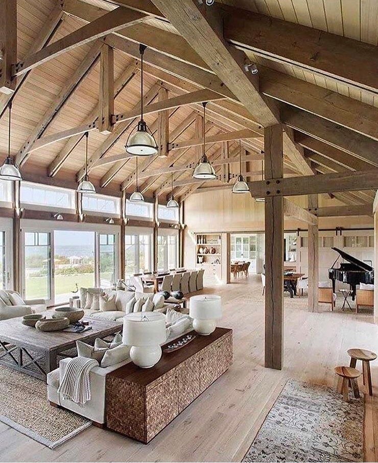 Inspiration for an expansive country open concept family room in Toronto with a music area, light hardwood floors, no tv, brown walls and brown floor.