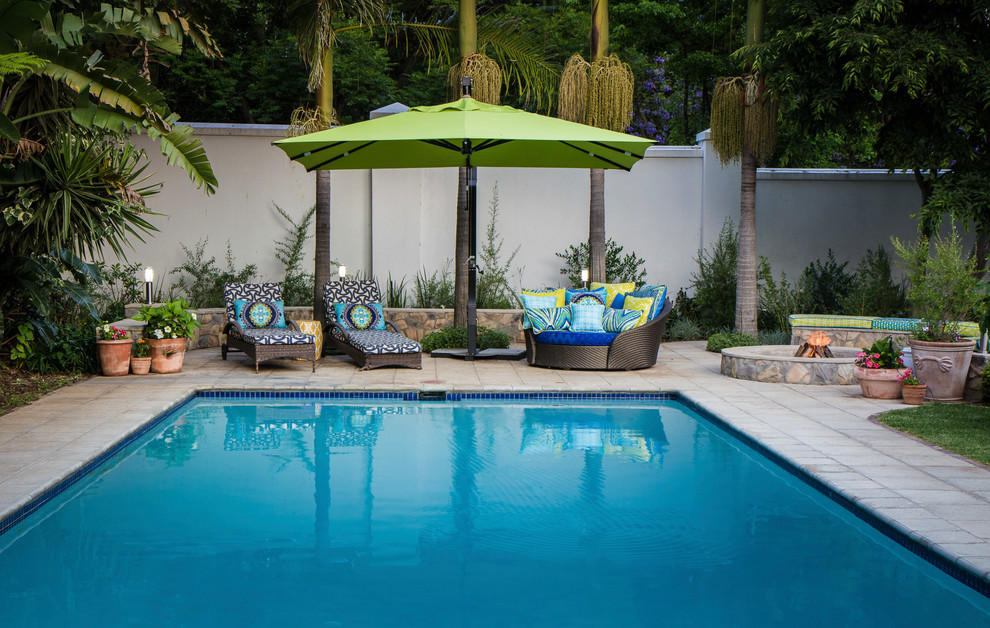 Pool - large transitional backyard concrete paver and rectangular lap pool idea