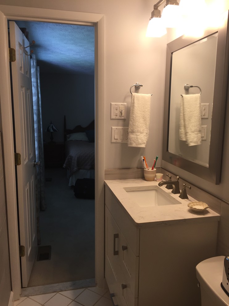 Design ideas for a small transitional master bathroom in Baltimore with shaker cabinets, white cabinets, an alcove shower, a two-piece toilet, gray tile, porcelain tile, grey walls, ceramic floors, an undermount sink, engineered quartz benchtops, white floor and a shower curtain.