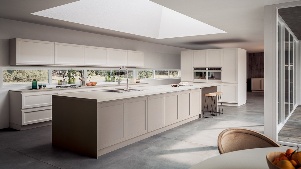 Example of a mid-sized transitional eat-in kitchen design with shaker cabinets, beige cabinets and an island