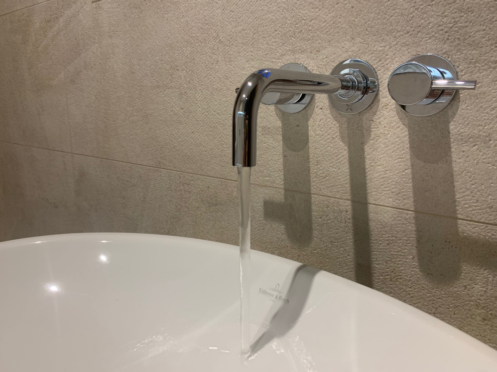 Wall mounted basin tap