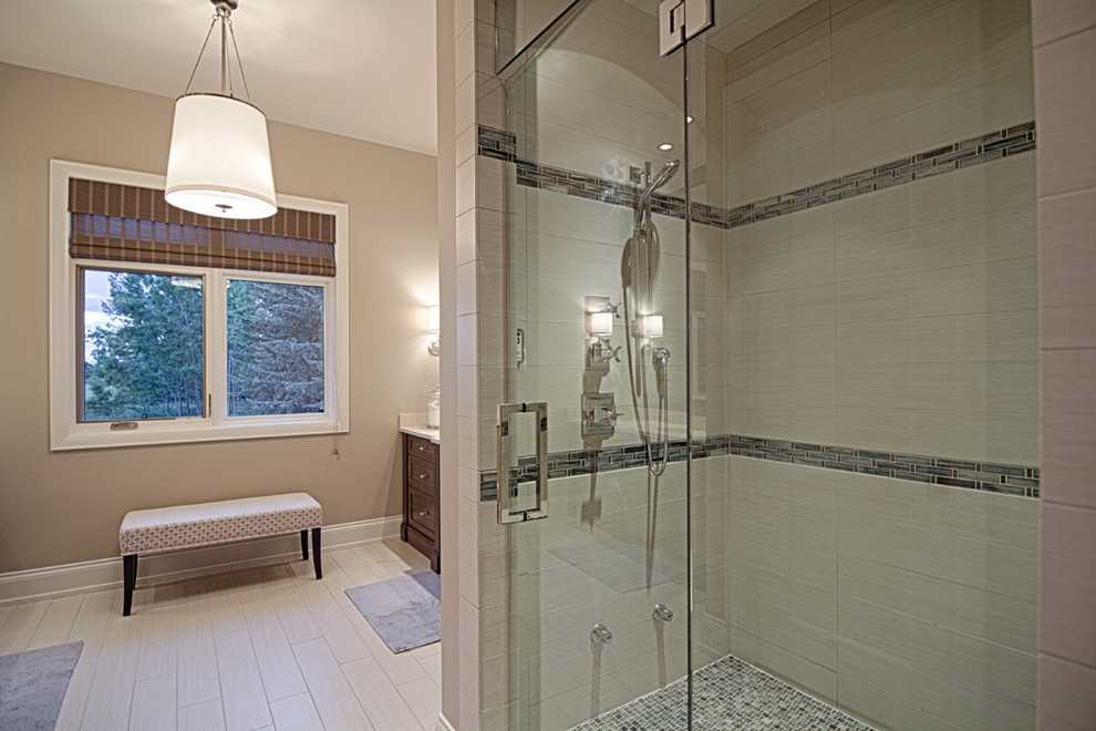 Example of a transitional home design design in Calgary