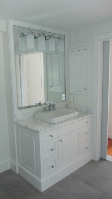 Inspiration for a large country master bathroom in Philadelphia with a vessel sink, white cabinets, an alcove shower, a wall-mount toilet, gray tile, white walls and ceramic floors.