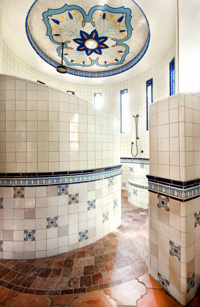 Mediterranean master bathroom in Houston with an open shower, multi-coloured tile and an open shower.