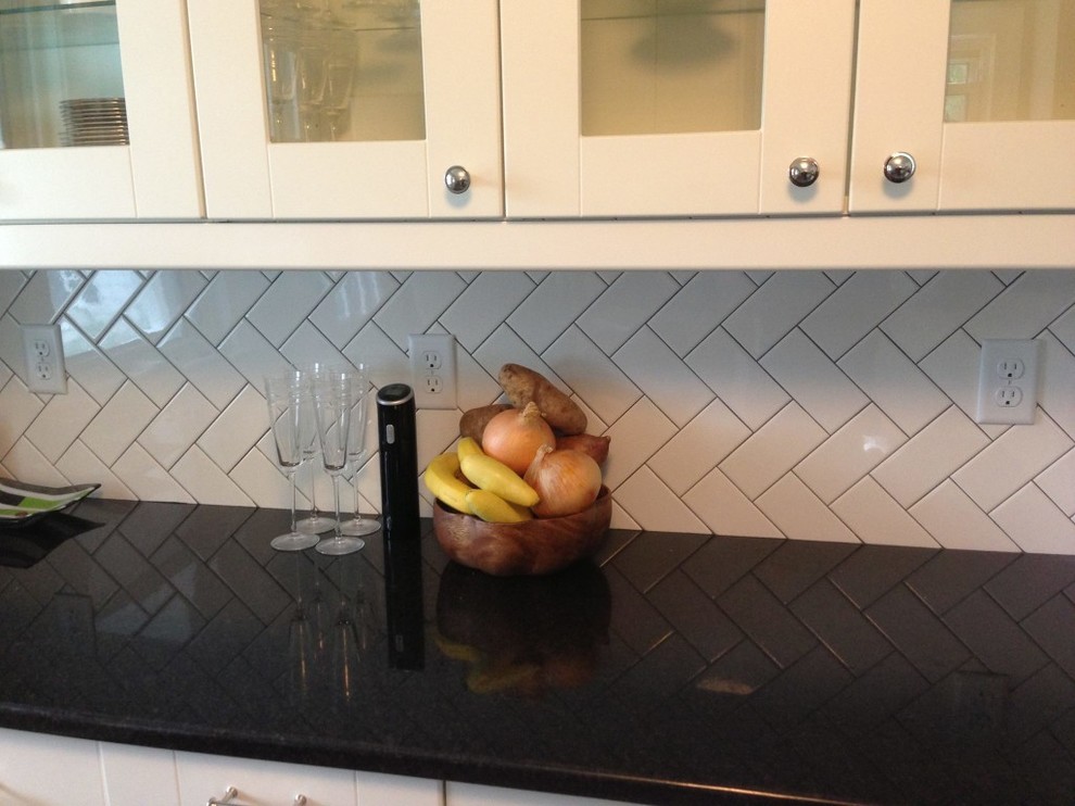 Example of a transitional home design design in Boston