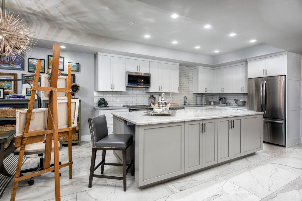 Inspiration for a mid-sized transitional l-shaped eat-in kitchen remodel with flat-panel cabinets, white cabinets and an island
