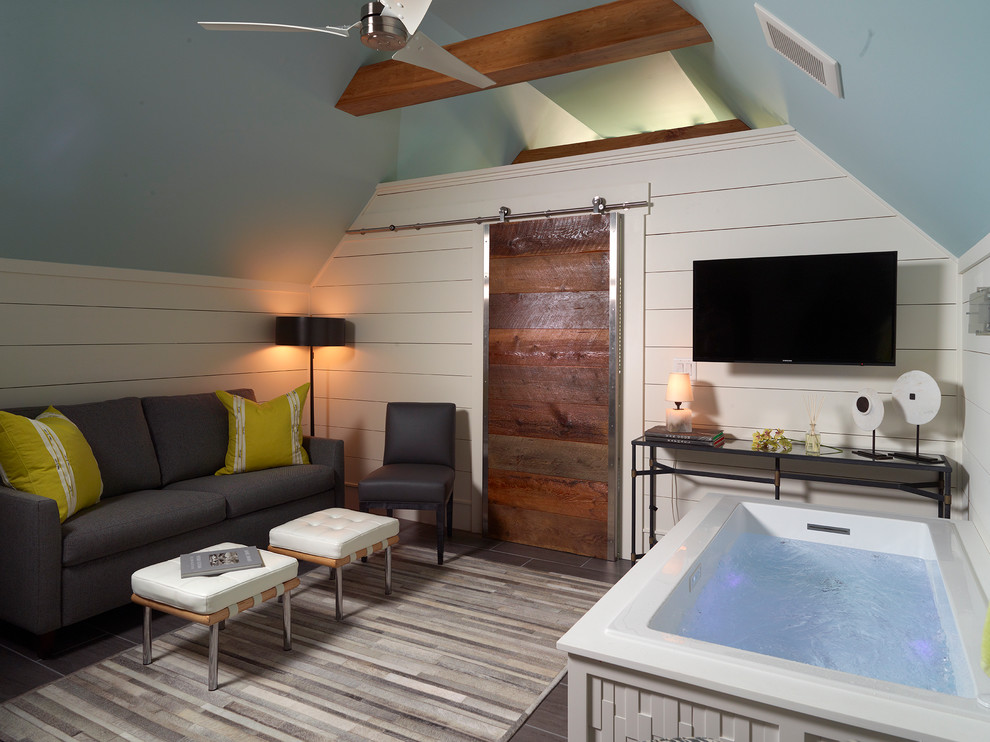 Large transitional master drop-in bathtub photo with white walls