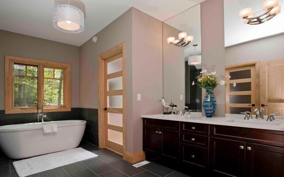 Design ideas for a large arts and crafts master bathroom in Vancouver with an undermount sink, shaker cabinets, dark wood cabinets, quartzite benchtops, a freestanding tub, brown walls and ceramic floors.