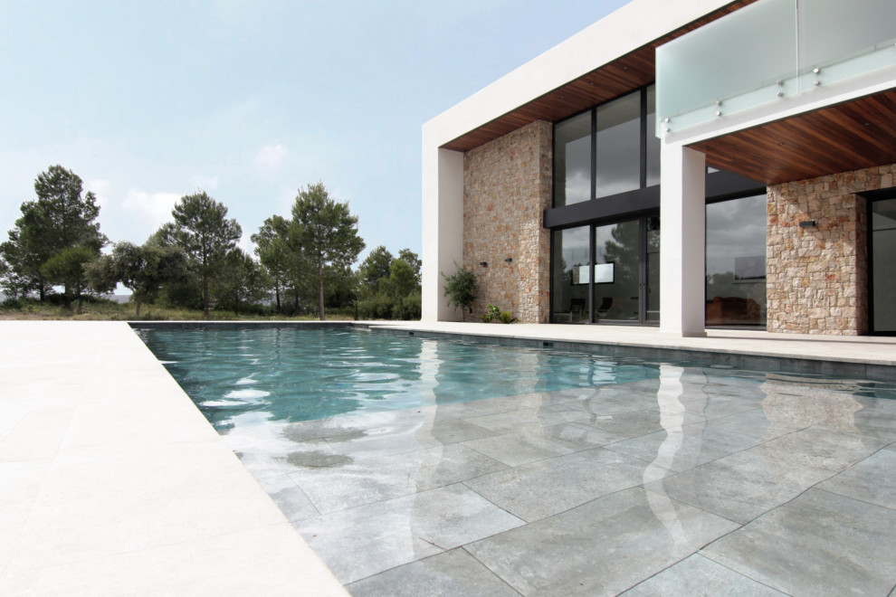 Photo of an expansive modern pool.