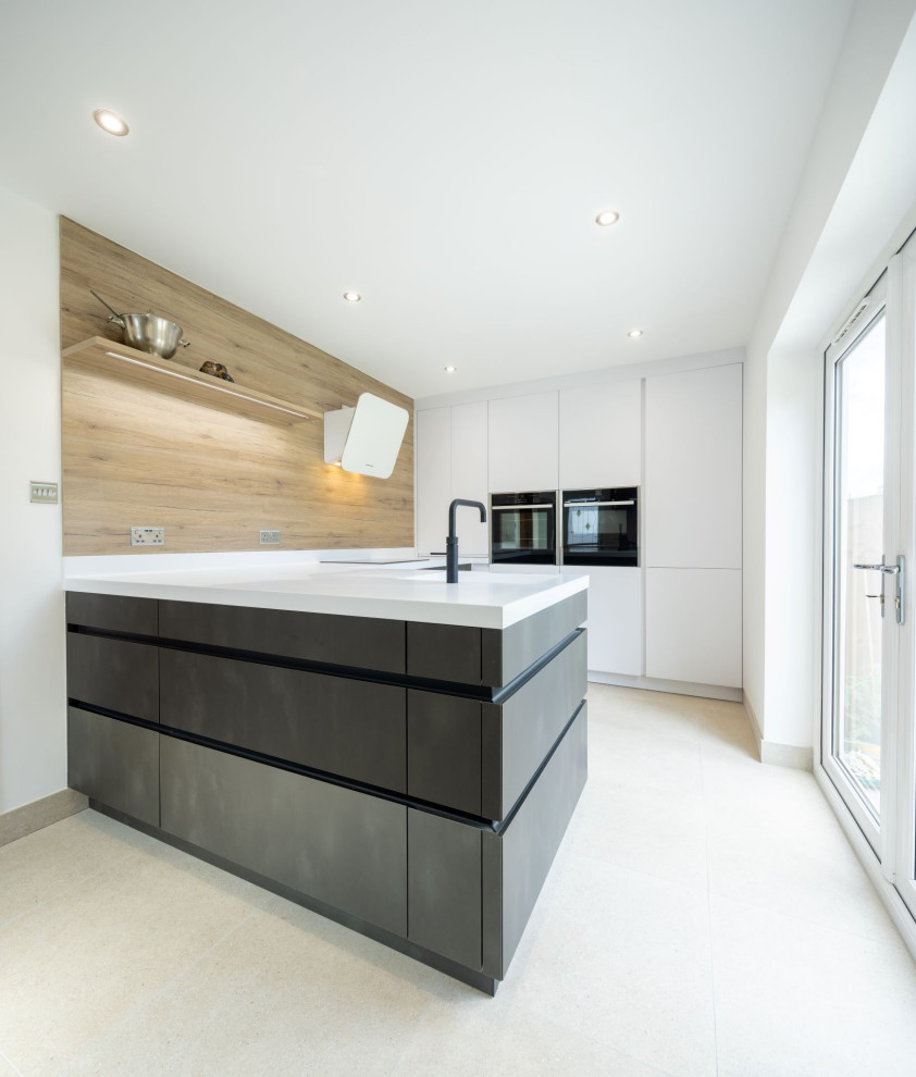 Inspiration for a mid-sized contemporary u-shaped eat-in kitchen in Other with an integrated sink, flat-panel cabinets, grey cabinets, solid surface benchtops, timber splashback, panelled appliances and white benchtop.