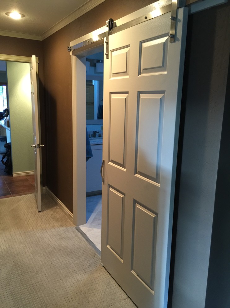 Inspiration for a mid-sized transitional gray tile and porcelain tile gray floor and ceramic tile walk-in shower remodel in Phoenix with an undermount sink, a hinged shower door, blue walls, shaker cabinets, white cabinets and granite countertops