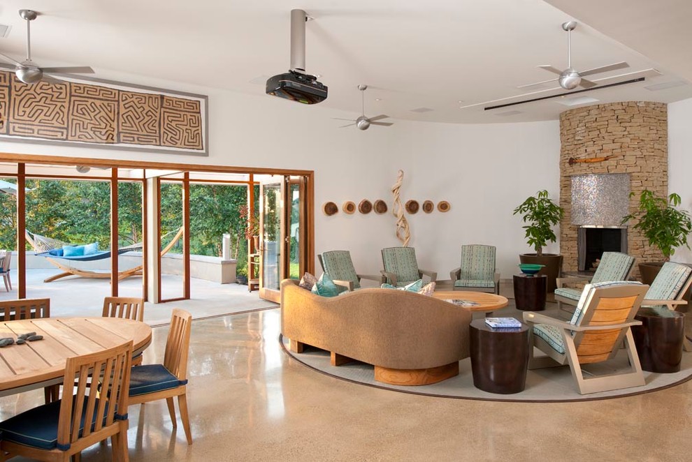 Photo of a large midcentury open concept living room in Dallas with white walls and concrete floors.