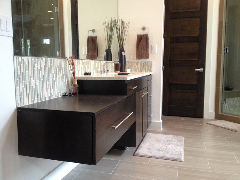 Bathroom - transitional beige tile bathroom idea in Austin with raised-panel cabinets and medium tone wood cabinets