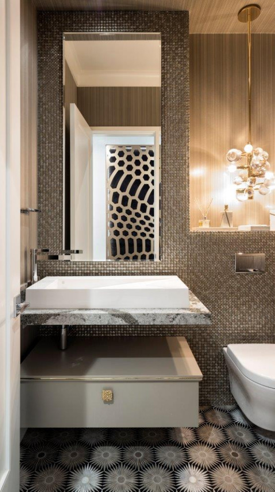 Inspiration for a contemporary powder room in Minneapolis with flat-panel cabinets, grey cabinets, a wall-mount toilet, gray tile, mosaic tile, a vessel sink, multi-coloured floor and multi-coloured benchtops.