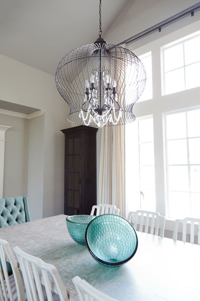 Example of a mid-sized beach style dark wood floor kitchen/dining room combo design with gray walls