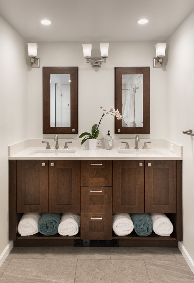 Photo of a mid-sized modern master bathroom in Seattle with shaker cabinets, dark wood cabinets, white tile, porcelain tile, porcelain floors, an undermount sink, engineered quartz benchtops and grey floor.