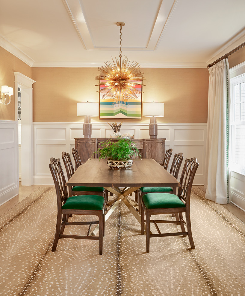 Transitional separate dining room in New York with brown walls, medium hardwood floors, brown floor and decorative wall panelling.