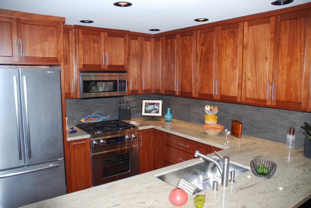 Inspiration for a small transitional dark wood floor eat-in kitchen remodel in Orange County with a drop-in sink, light wood cabinets, granite countertops, multicolored backsplash, stone slab backsplash, stainless steel appliances and an island