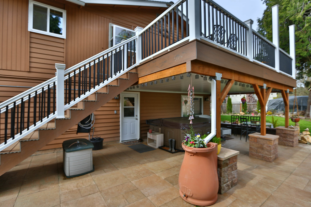 Mid-sized mountain style backyard deck photo in Seattle