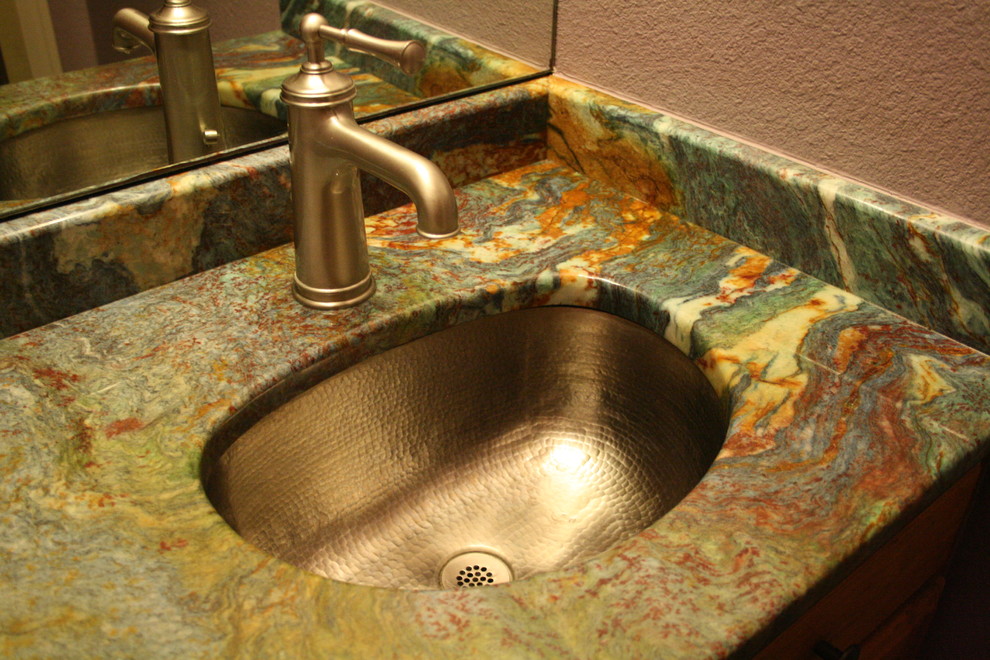 Home design - small transitional porcelain tile home design idea in Austin with an undermount sink, raised-panel cabinets, light wood cabinets, granite countertops and beige walls