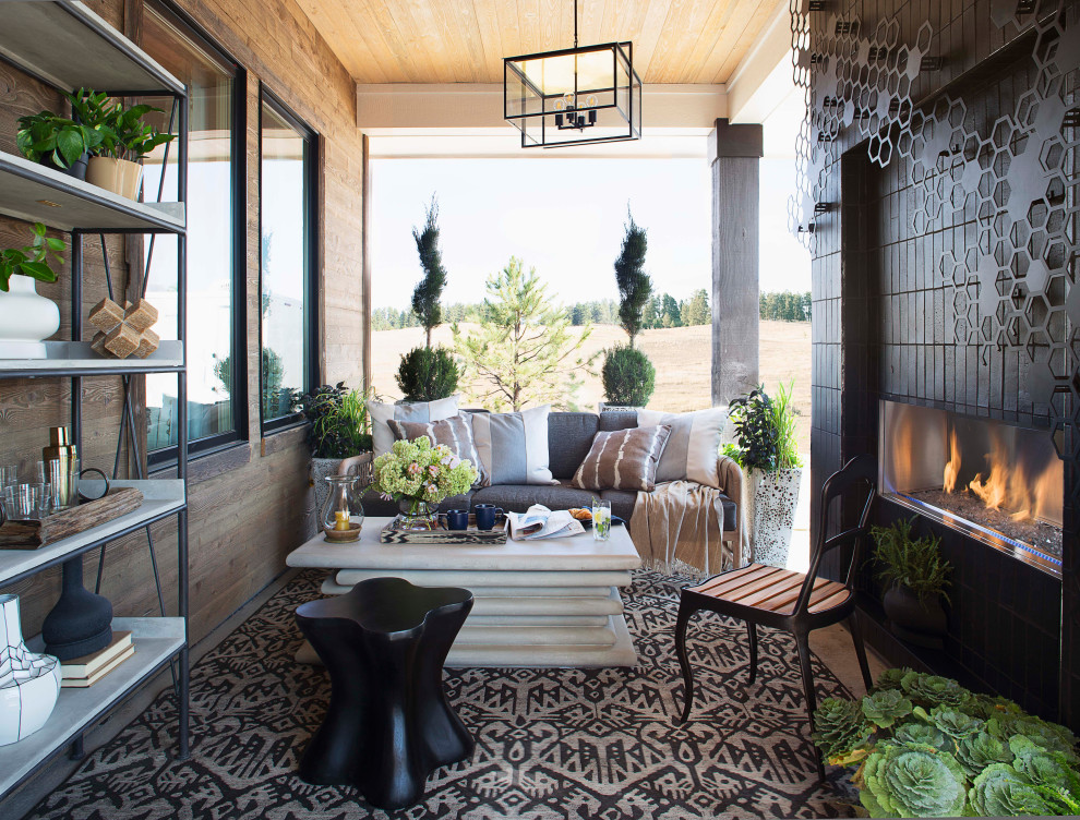 Inspiration for a mid-sized country front yard patio in Denver with with fireplace and brick pavers.