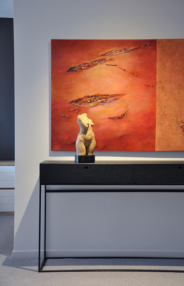 This is an example of a mid-sized contemporary master bedroom in Sydney with grey walls, carpet and grey floor.