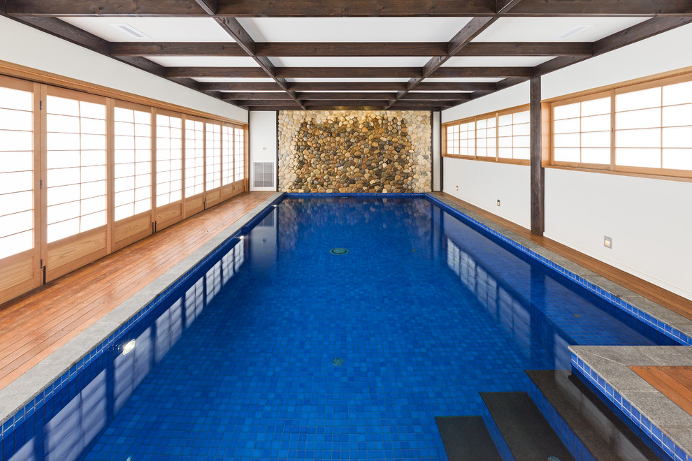 Inspiration for a large asian indoor rectangular lap pool in Melbourne with decking.