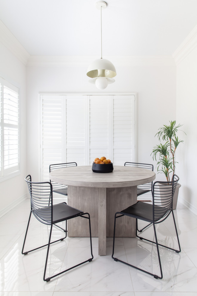Photo of a mid-sized scandinavian dining room in Toronto with white walls.