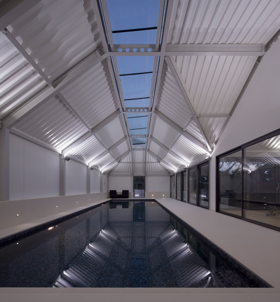 Mid-sized contemporary multipurpose gym in London with white walls, ceramic floors and white floor.