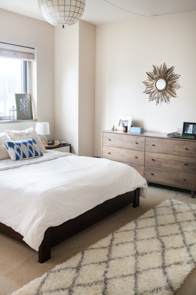 Design ideas for a small eclectic master bedroom in San Francisco with carpet.