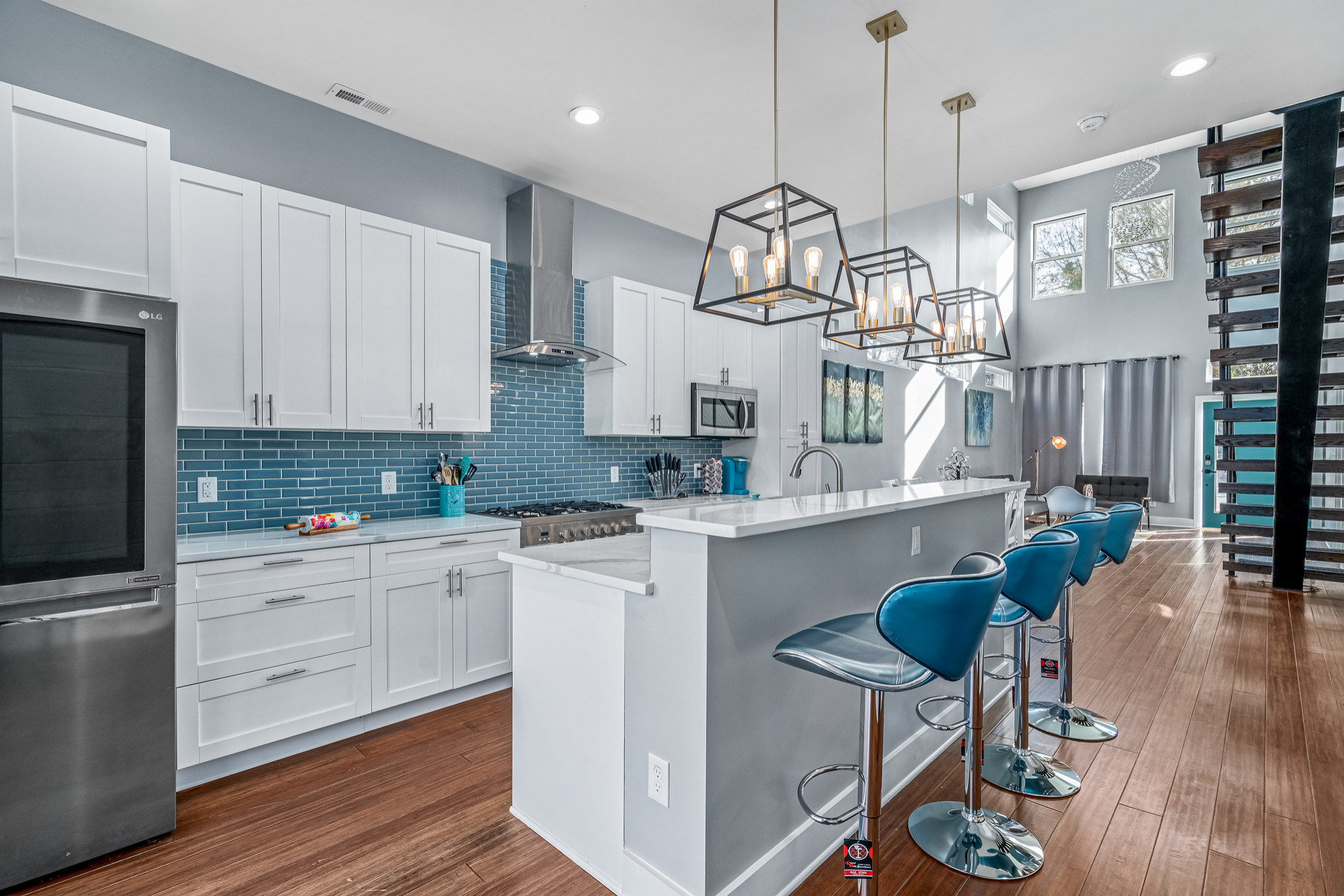 Blue and Aqua Cabinets Make a Splash in a Colorful Kitchen