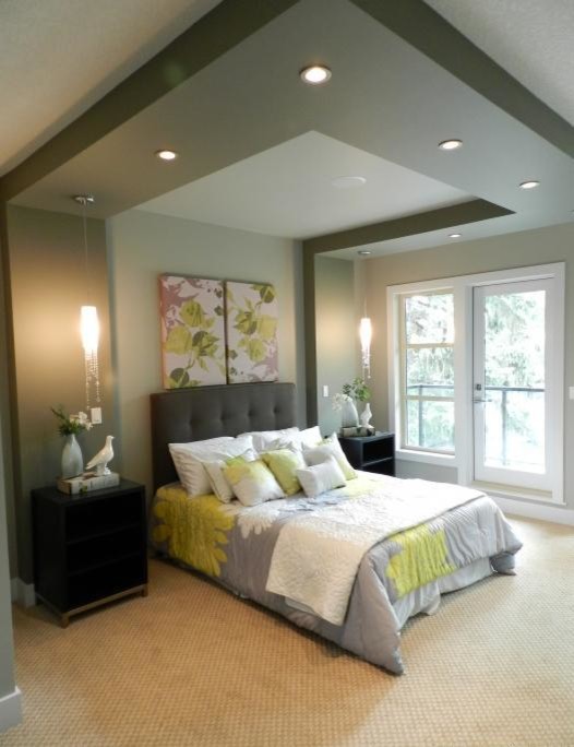 Mid-sized contemporary master bedroom in Calgary with grey walls and carpet.