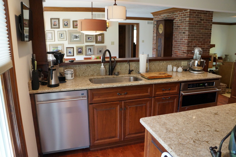This is an example of a mid-sized arts and crafts kitchen in Indianapolis.
