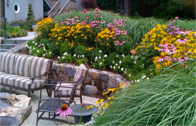 Design ideas for a contemporary backyard full sun formal garden in Boston with a container garden and concrete pavers.