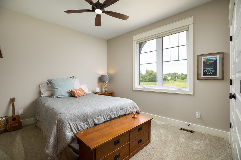 Design ideas for a mid-sized country guest bedroom in Grand Rapids with beige walls, carpet and beige floor.
