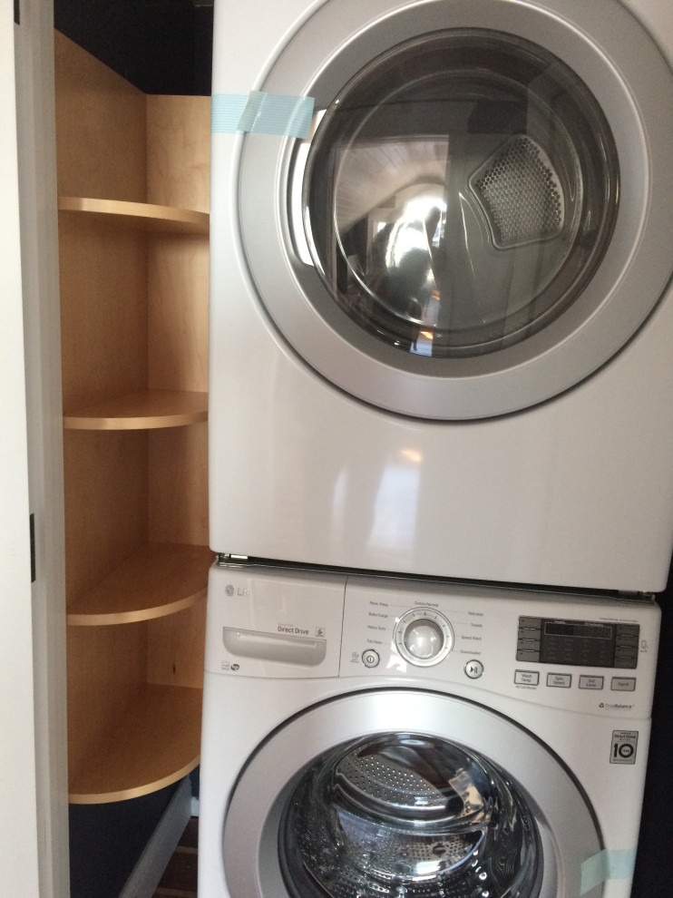 This is an example of a beach style laundry room in New York.