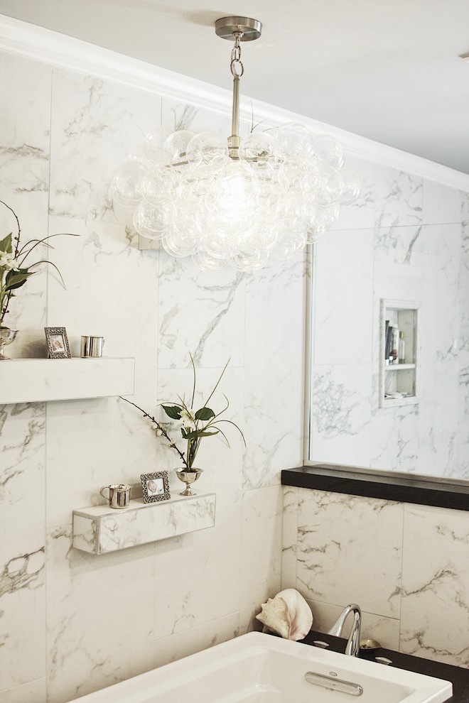 Drop-in bathtub - large transitional master gray tile, white tile and porcelain tile porcelain tile and white floor drop-in bathtub idea with shaker cabinets, white cabinets, a two-piece toilet, white walls, an undermount sink, solid surface countertops and a hinged shower door