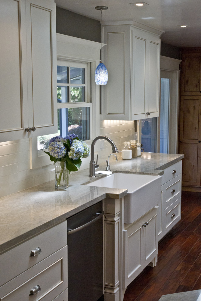 Traditional kitchen in San Francisco with subway tile splashback and a farmhouse sink.