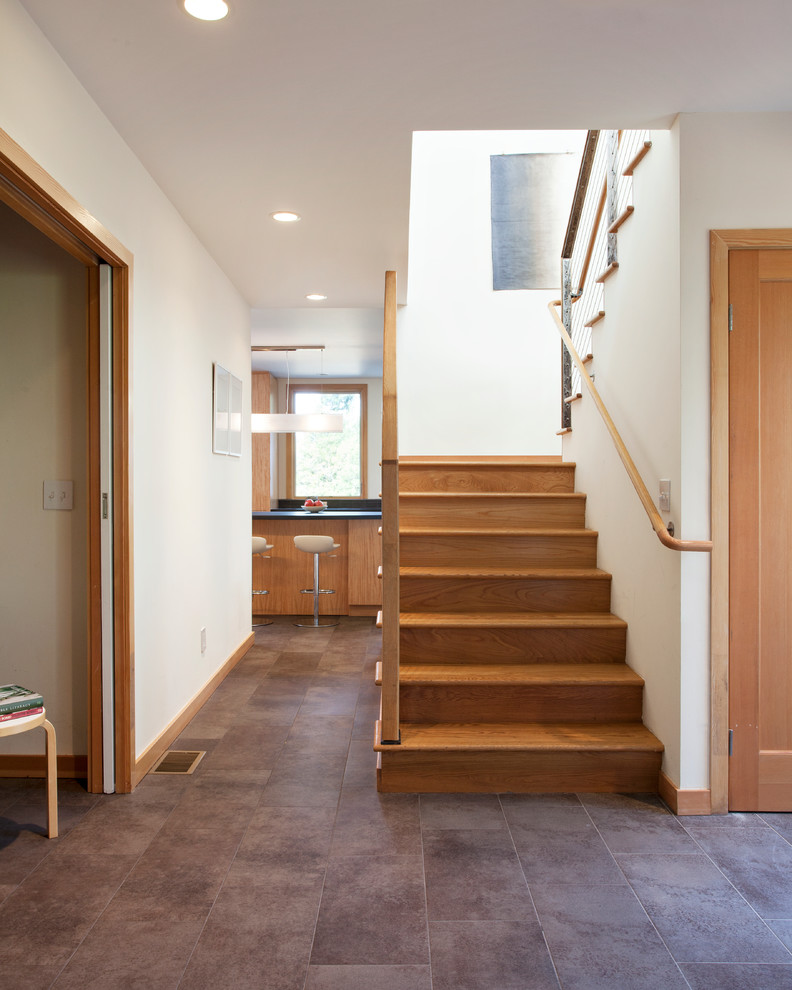 Mid-sized modern hallway in San Francisco with white walls and ceramic floors.